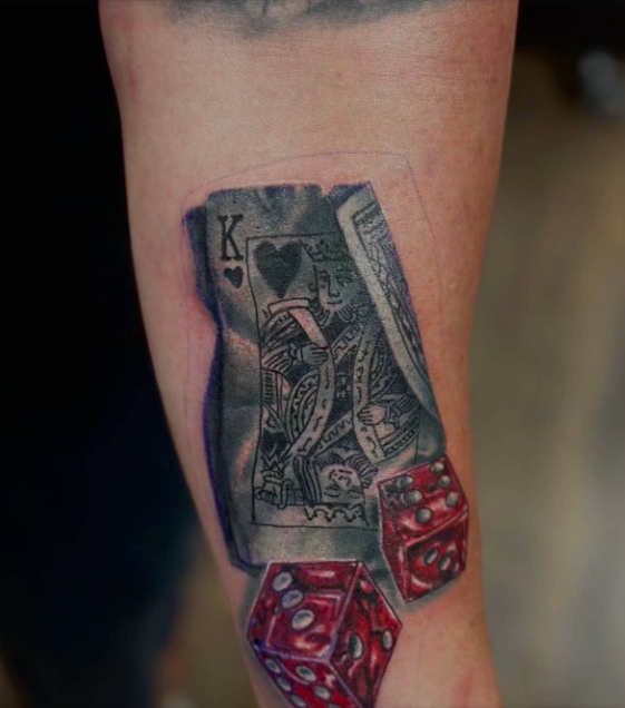 King of hearts card with dice tattoo